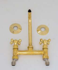 Handcrafted antique brass wall mount faucet for vintage and modern bathrooms
