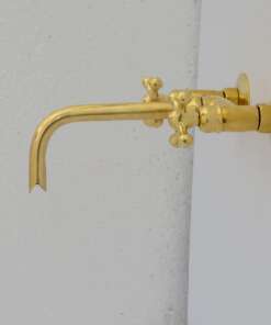 Handcrafted antique brass wall mount faucet for vintage and modern bathrooms