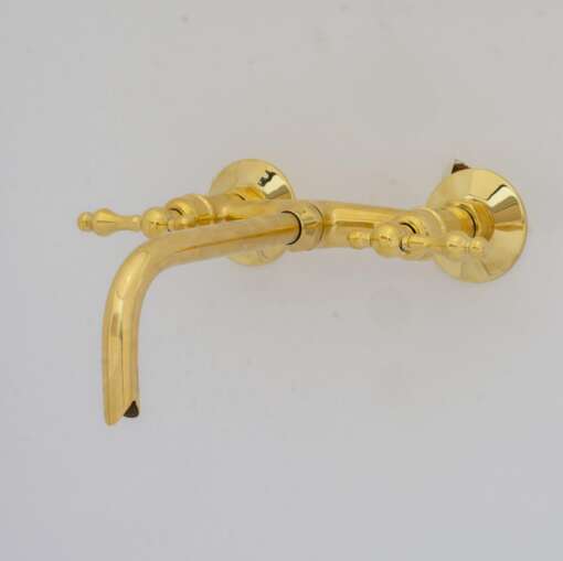 Handcrafted antique brass wall mount faucet for vintage and modern bathrooms