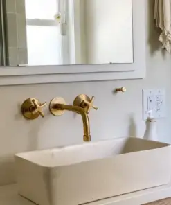 Built-in hammered brass bathroom faucet with wall-mount design