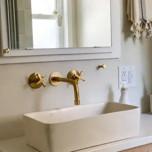 Built-in hammered brass bathroom faucet with wall-mount design