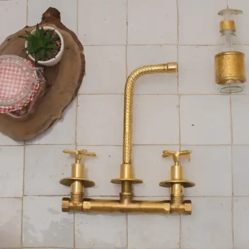 Built-in hammered brass bathroom faucet with wall-mount design