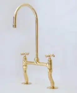 Vintage patina brass bridge kitchen faucet with curved legs and cross handles