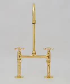 Vintage patina brass bridge kitchen faucet with curved legs and cross handles
