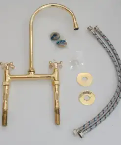 Vintage patina brass bridge kitchen faucet with curved legs and cross handles