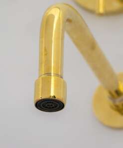 Wall mount tub filler with sleek design and brass finish for freestanding bathtubs