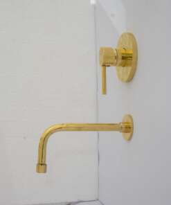 Wall mount tub filler with sleek design and brass finish for freestanding bathtubs