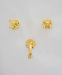 Wall-mounted tub filler with sleek design and brass finish for freestanding bathtubs