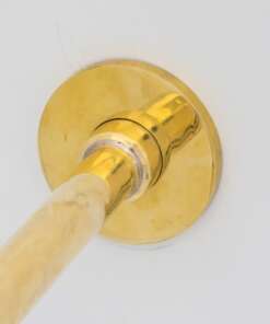 Wall-mounted tub filler with sleek design and brass finish for freestanding bathtubs