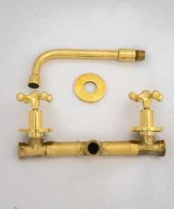 Wall-mounted tub filler with sleek design and brass finish for freestanding bathtubs