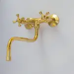 Antique brass kitchen faucet with wall-mount design